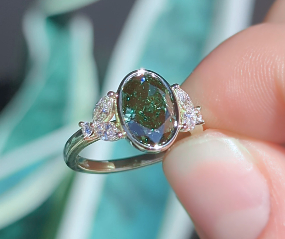 Mirabelle Ring: bezel set 2 ct oval lab diamond with marquise and round side stones