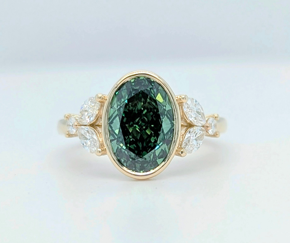 Mirabelle Ring: bezel set 2 ct oval lab diamond with marquise and round side stones
