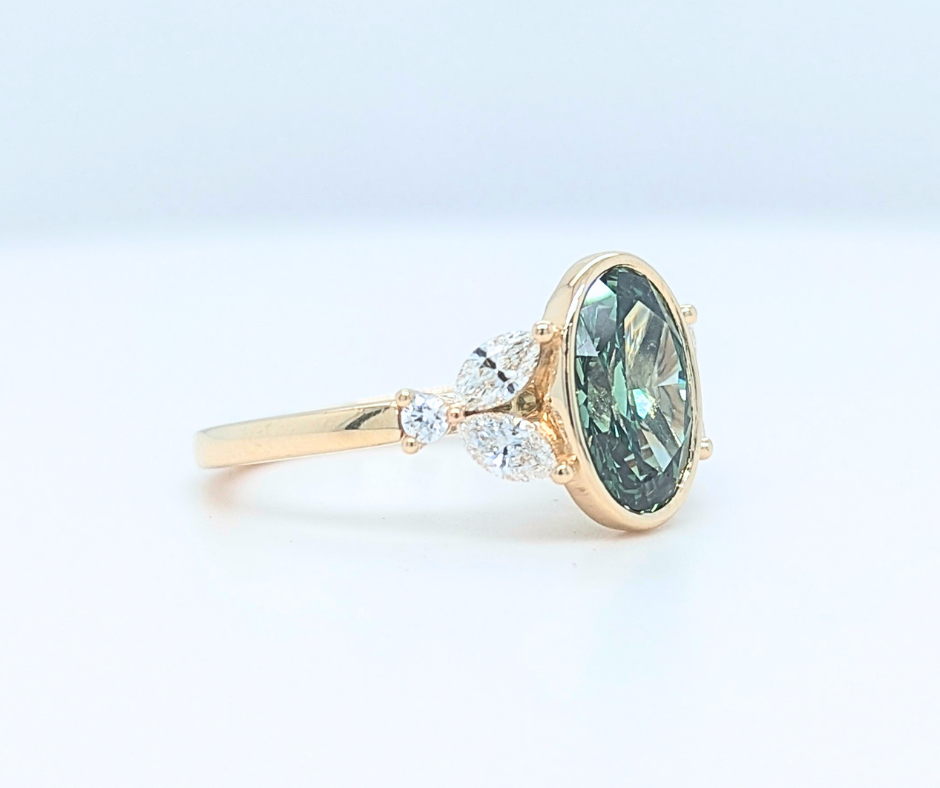 Mirabelle Ring: bezel set 2 ct oval lab diamond with marquise and round side stones