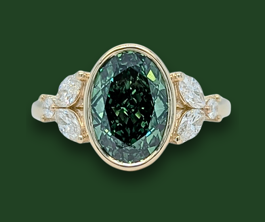Mirabelle Ring: bezel set 2 ct oval lab diamond with marquise and round side stones