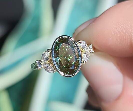 Mirabelle Ring: bezel set 2 ct oval lab diamond with marquise and round side stones