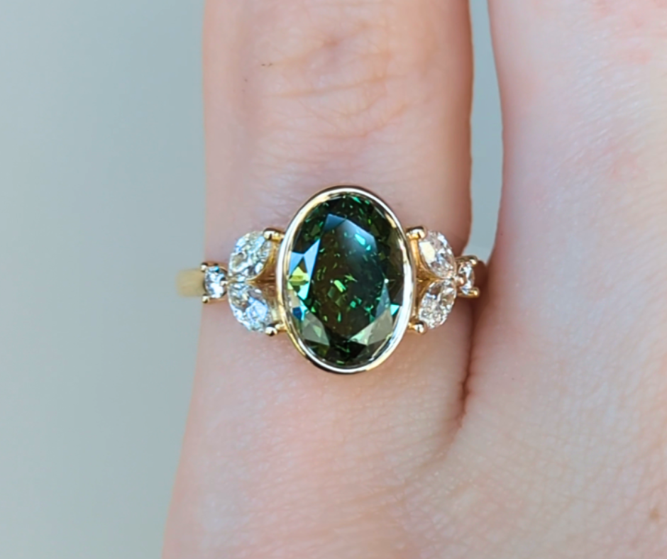 Mirabelle Ring: bezel set 2 ct oval lab diamond with marquise and round side stones